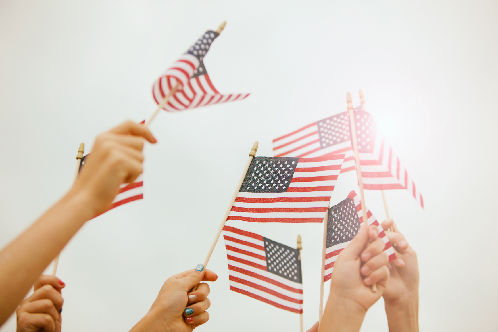 Parade: Hands Waving American Flags In Sky