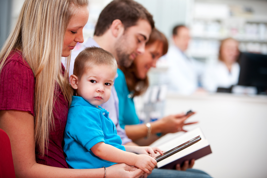Pharmacy:Child Sitting in Mother's Lap at the Pharmacy